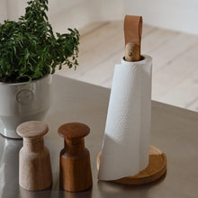 Cargar imagen en el visor de la galería, Wooden salt and pepper shakers with a paper towel holder on a countertop next to a plant.