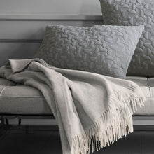 Cargar imagen en el visor de la galería, Gray textured pillows and blanket on a sofa with a neutral background