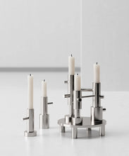 Cargar imagen en el visor de la galería, Silver candle holder with candles on a white background
