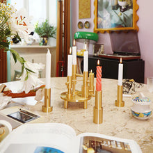 Cargar imagen en el visor de la galería, Decorative candle holders on a table with a blurred indoor background