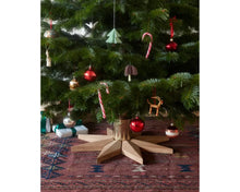 Load image into Gallery viewer, Decorated Christmas tree with various ornaments on a star-shaped stand.