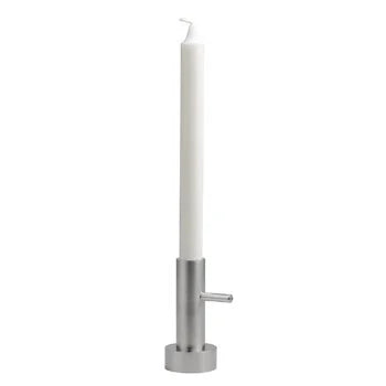 Tall white candle on a metallic stand against a white background