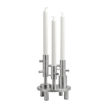 Cargar imagen en el visor de la galería, Metallic candle holder with three white candles on a white background

