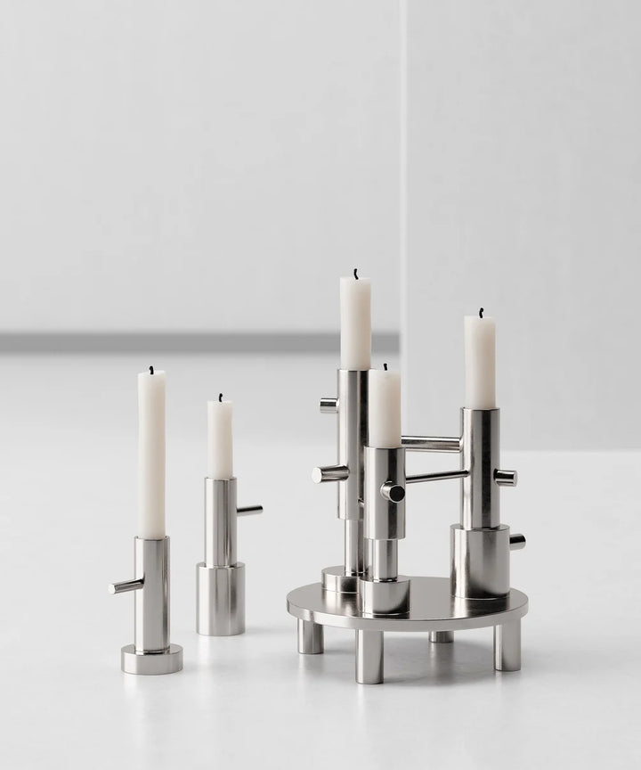 Silver candle holder with candles on a white background